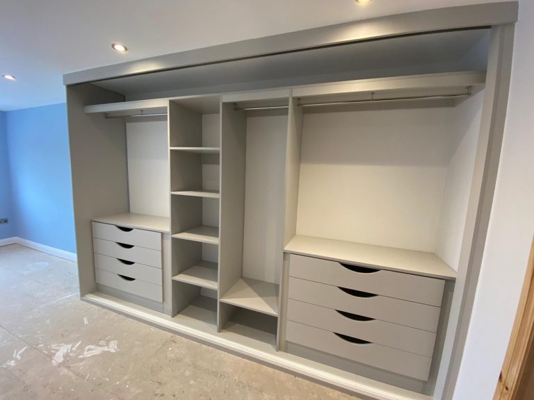 wardrobe interior - grey with shelves, hanging rails and drawers