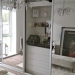 Interior of wardrobe with sliding doors and mirrors