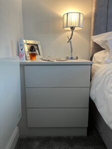 Custom made bedside table with smooth handleless drawers and soft close fittings, designed by Creative Joinery.