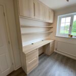 Fitted office furniture with Avienda style cupboard doors and drawers.