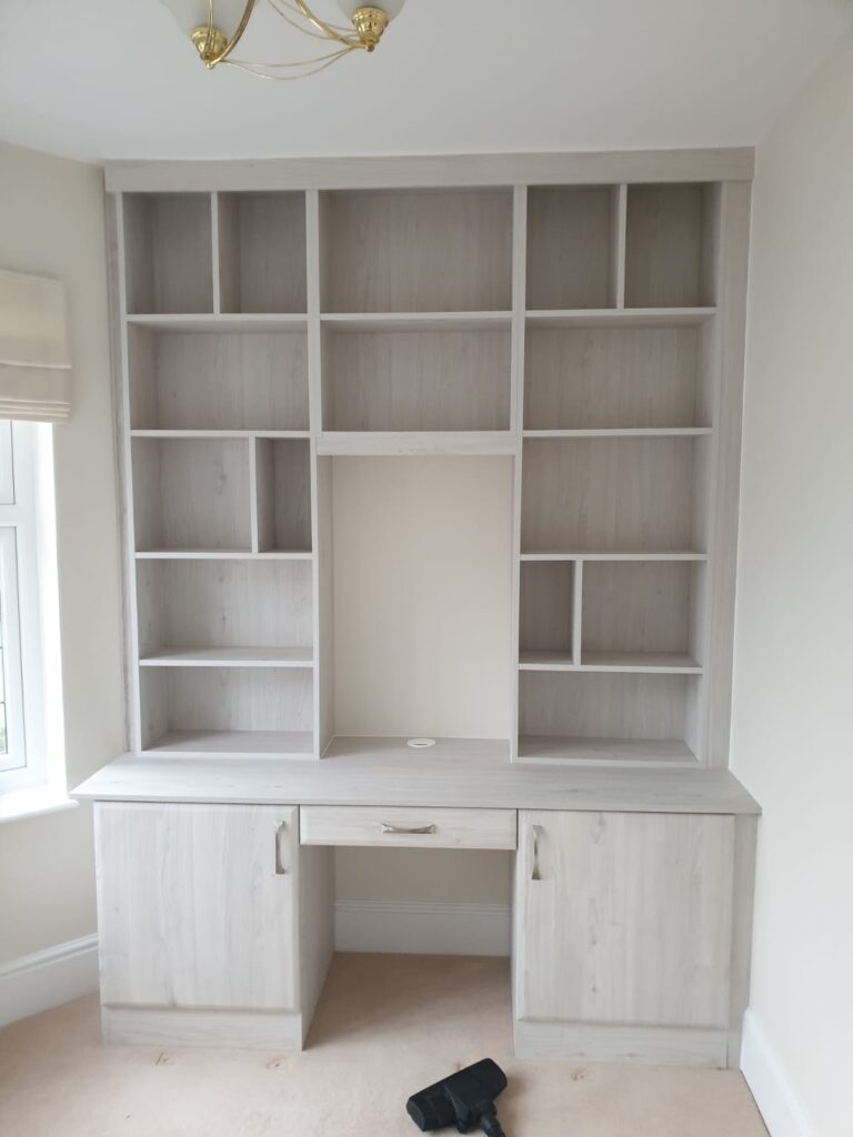 Fitted office furniture with lots of shelving, made to the customers design.