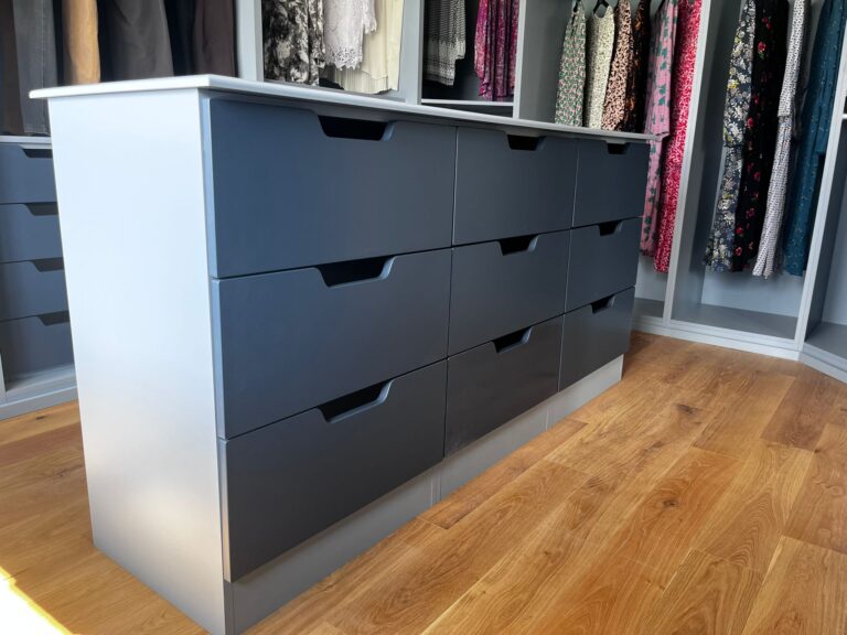 free standing blue custom drawers units in a dressing room