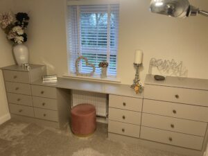 Fitted bespoke drawers with a dressing table incorporated