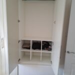 Interior fitted with box shelving and hanging rail - White