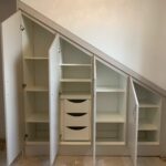 PVC Vienna angled opening wardrobes - White. Angled interior with shelving and drawers fitted
