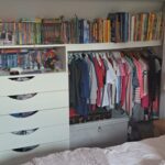 Interior of wardrobe with drawers, shelves and rail - White