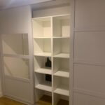 inside white sliding wardrobe with mirrors - Cube shelves