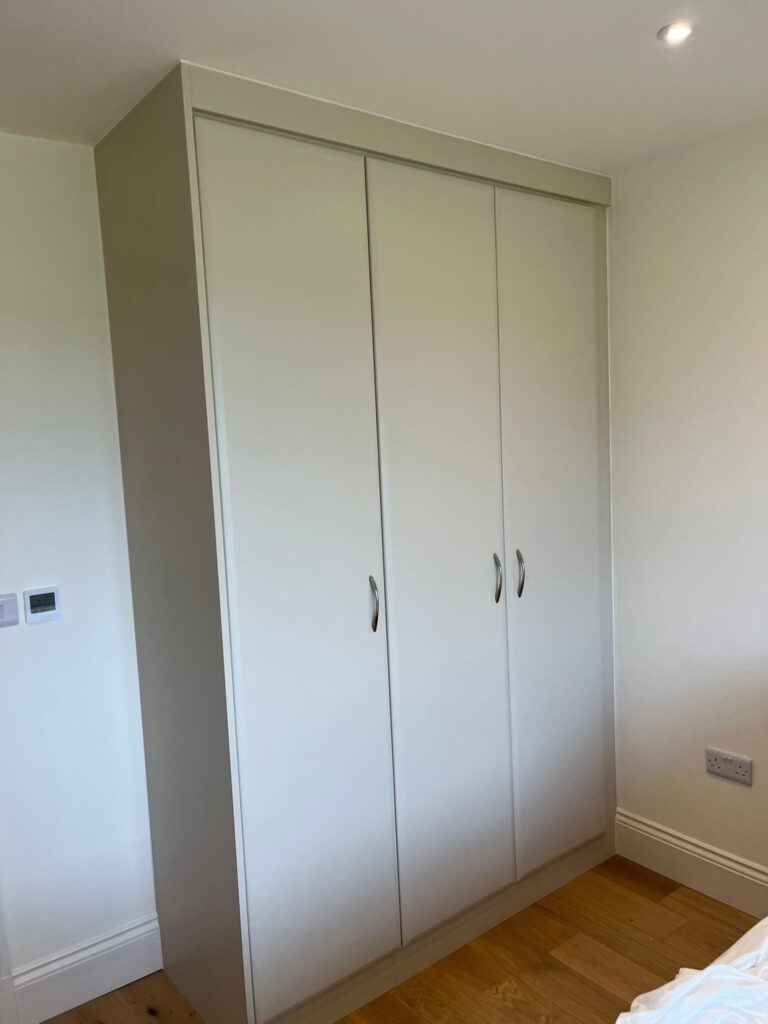 Bespoke fitted triple wardrobe in the colour mussel