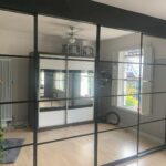 Made to measure crittall mirrored sliding door wardrobe in the colour Black