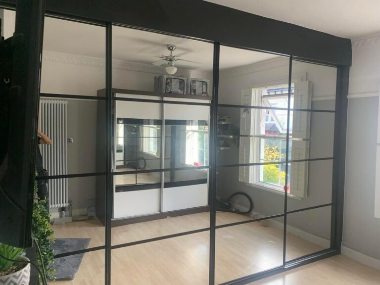 Made to measure crittall mirrored sliding door wardrobe in the colour Black
