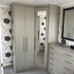custom tall boy drawers fitted to a bespoke corner wardrobe by Creative Joinery