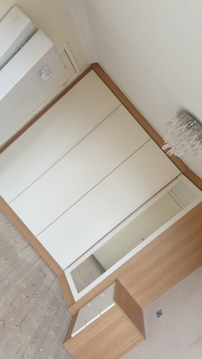 bespoke fitted wardrobes with handle less doors.