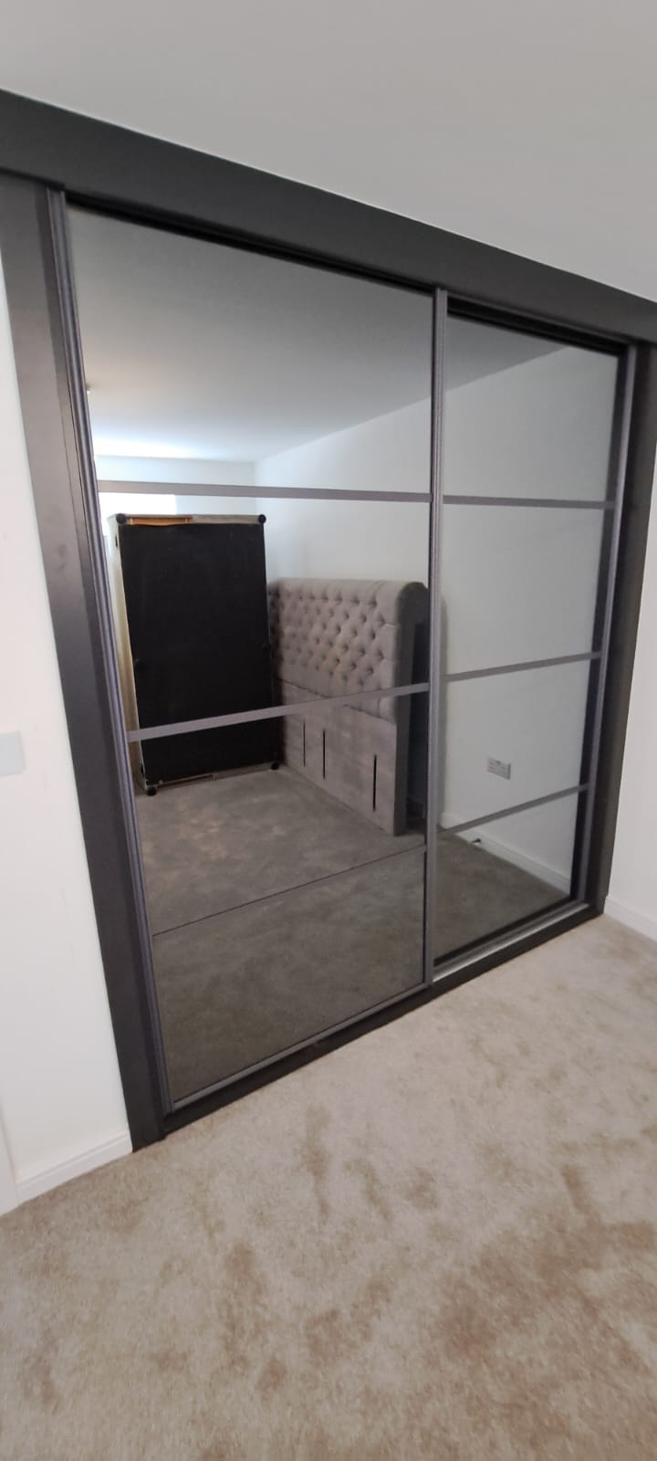Bespoke sliding door wardrobe with grey tinted mirrors, two doors