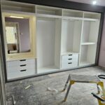 Interior of wardrobe with vanity area, 6 drawers and 3 hanging space
