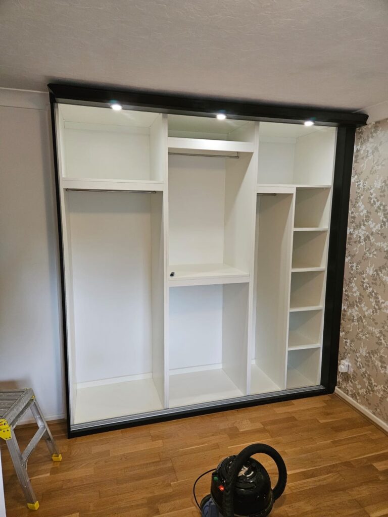 Wardrobe interior with optional back panels and top panels for a fully enclosed finish