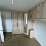 Bridge over bed and corner wardrobe fitted in the Oslo style, Sonoma Oak colour finish