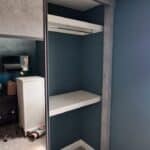 2 drawer grey wardrobe with sliding doors and mirrors - Interior with a rail and shelf