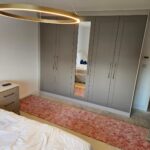 fitted wardrobes with a full length mirror in the centre door