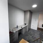 Fitted double wardrobe and desk with one set of three drawers and one cupboard
