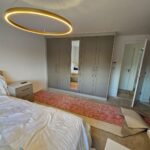 fitted wardrobes with a full length mirror in the centre door