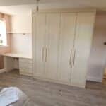 Fitte wardrobes and desk in the Shaker style and Ivory colour finish.