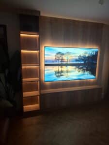 bespoke media wall with shelving, custom cupboardsand accent lighting manufactured by Creative Joinery
