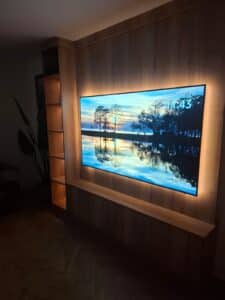 custom media wall with wood grain finish by Creative Joinery in Lancashire