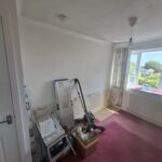 Picture of an undecorated wall. The picture shows the space where wardrobes will be fitted.