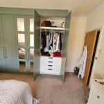 Interior of wardrobe with shelves, rail and drawer - Green