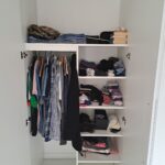 Interior of wardrobe with shelves and rail - White