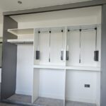Pull-down wardrobe hanging rail designed for easy-access clothes storage.