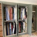 Open wardrobe interior with a bar rail fitted without a top shelf for maximum hanging height.
