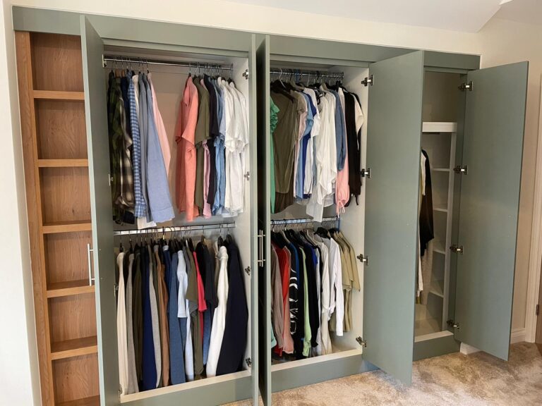 Open wardrobe interior with a bar rail fitted without a top shelf for maximum hanging height.