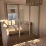 Bespoke Pebble Grey sl;iding door mirrored wardrobes