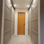 Shaker style sliding door wardrobes fitted in a hallway in Chorley, Lancashire