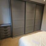 Bespoke Shaker panelled sliding wardrobes and fitted drawers