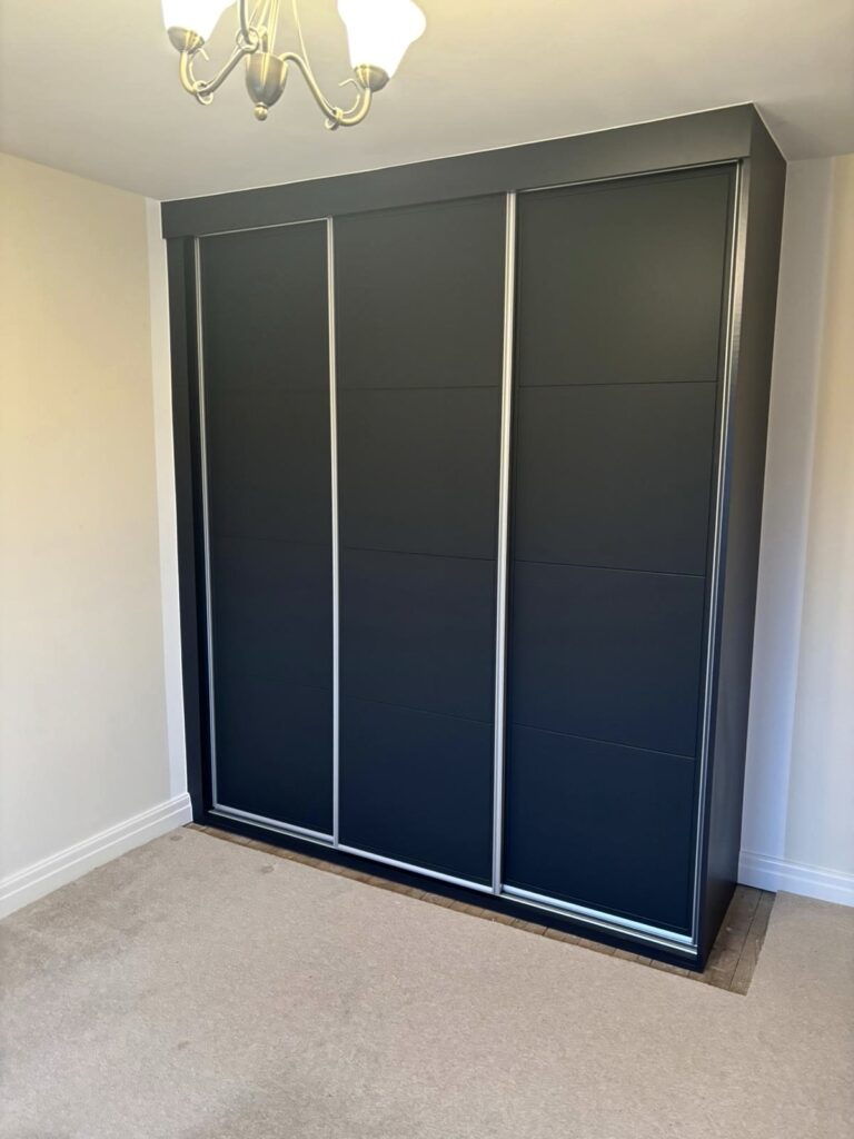 3 door sliding wardrobe with silver frames and black doors