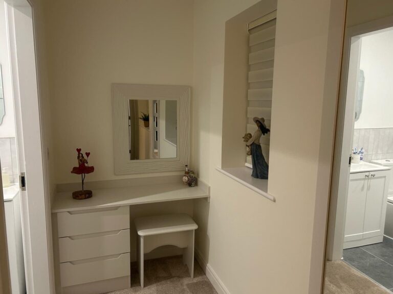 Made-to-measure dressing table with wall mounted feature mirror and stool to match.