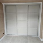 Bespoke Shaker sliding wardrobes in a neutral grey colour - cashmere - fitted by Creative Joinery Bedrooms in Ambleside