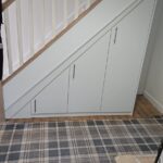 3 door cabinet built under stairs, angled