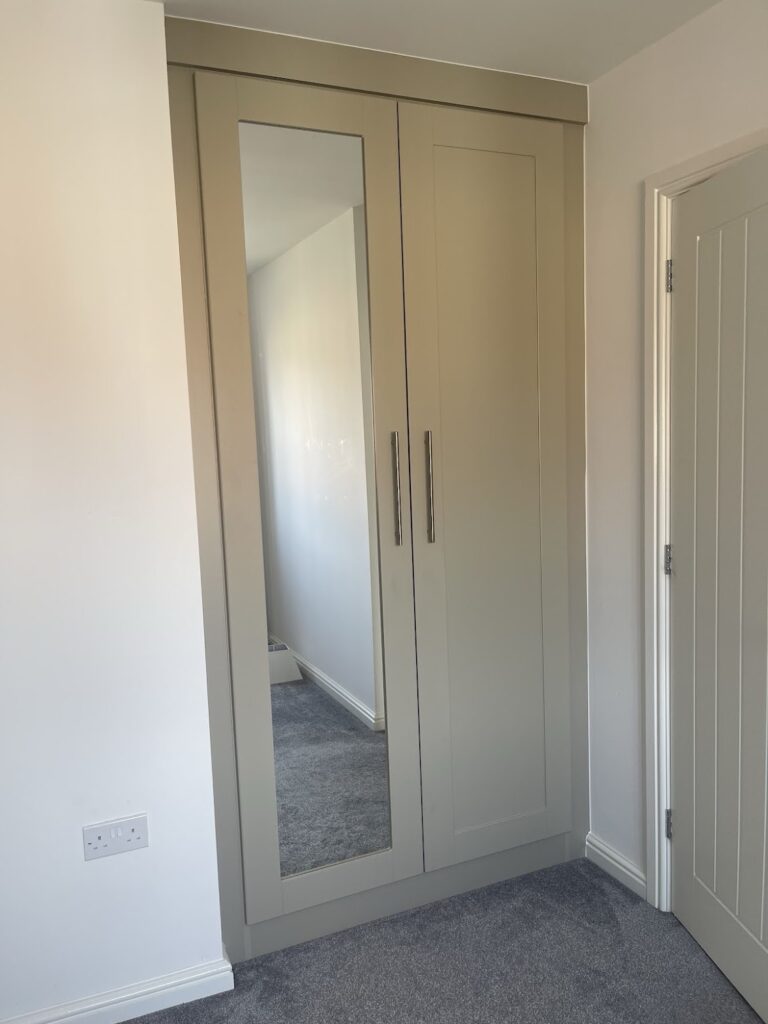 2 door shaker wardrobe with mirror panel. fitted in bedroom alcove