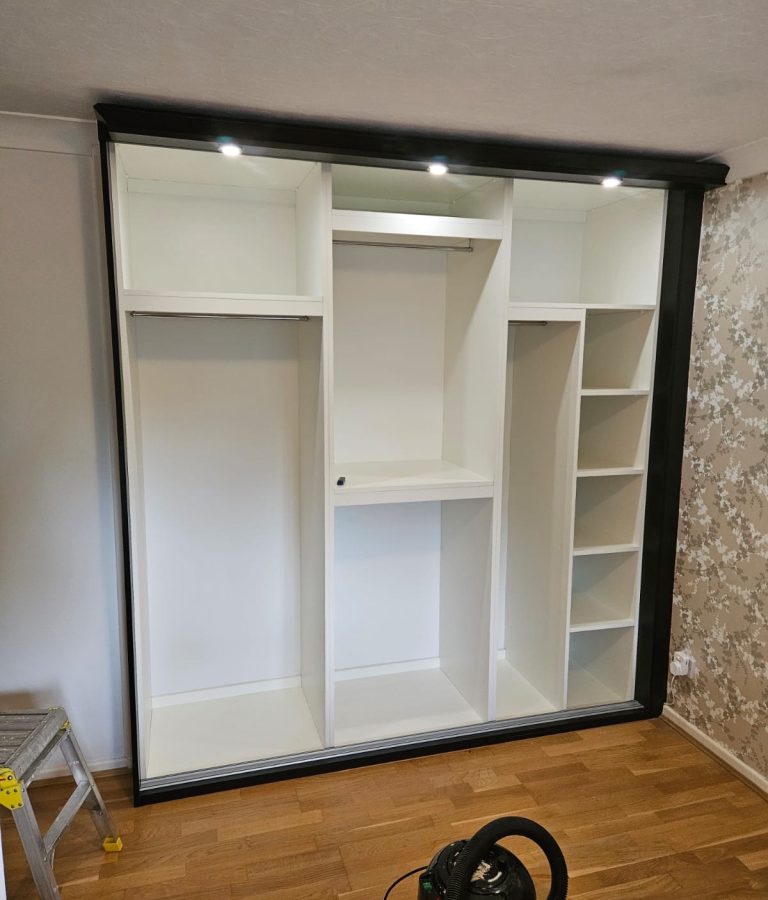 Wardrobe interior with optional back panels and top panels for a fully enclosed finish