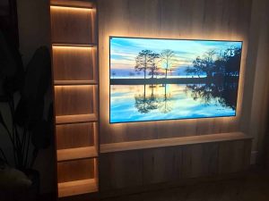 bespoke media wall with shelving, custom cupboardsand accent lighting manufactured by Creative Joinery