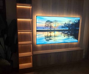 bespoke media wall with shelving, custom cupboardsand accent lighting manufactured by Creative Joinery